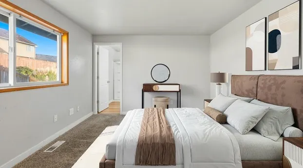Staged bedroom with upholstered headboard